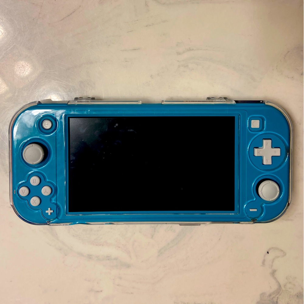 Nintendo Switch Lite- Teal w/clear protector case and zip case-Charger included.